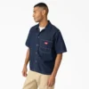 Camicia in denim a pantaloncini con bottoni Camicia in denim a pantaloncini con bottoni