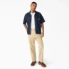 Camicia in denim a pantaloncini con bottoni Camicia in denim a pantaloncini con bottoni